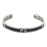 Gucci Armband i sterlingsilver och svart emalj med Interlocking G-deta...