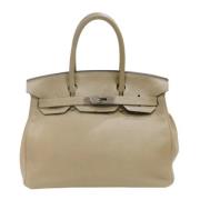 Hermès Vintage Pre-owned Laeder handvskor Beige, Dam