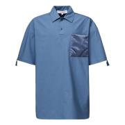 JW Anderson Polo skjorta med quiltad satin ficka Blue, Herr