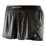 SKINS DNAmic Womens Superpose Short Svart/Gul X-Small Dam